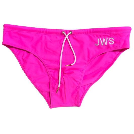 Hot pink men's swim brief flat-lay with white drawcord and gold tips — JWS Swimwear