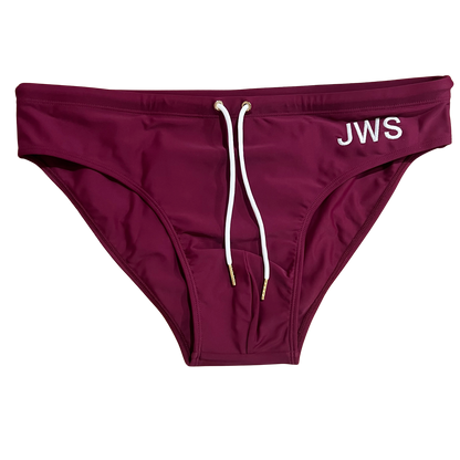 Burgundy men's swim brief flat-lay with white drawcord and gold tips — JWS Swimwear