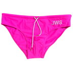 Hot pink men's swim brief flat-lay with white drawcord and gold tips — JWS Swimwear