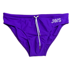 Royal purple men's swim brief flat-lay with white drawcord and gold tips — JWS Swimwear
