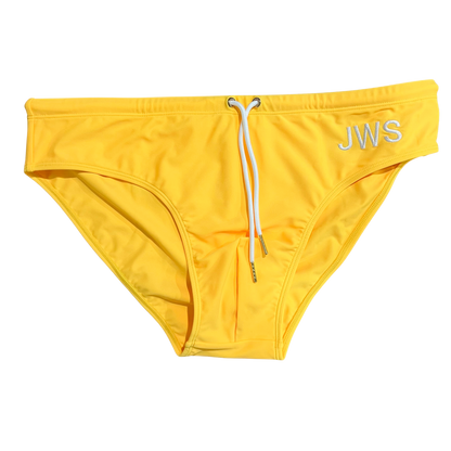 Sun yellow men's swim brief flat-lay with white drawcord and gold tips — JWS Swimwear
